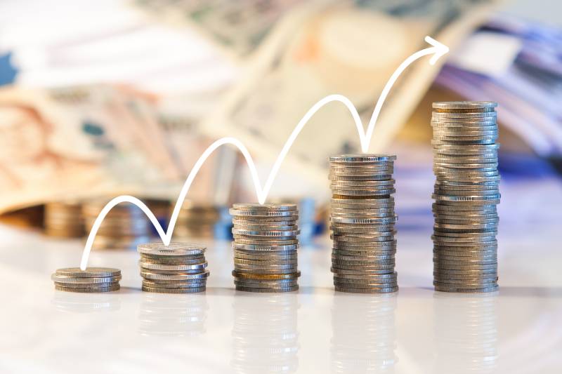 rows of coins, business, Finance and banking concept | Wage Growth Slows to 1.2% During the Last Quarter