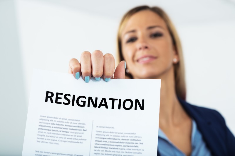 woman leaving a worthless job showing her resignation letter | Job Resignations